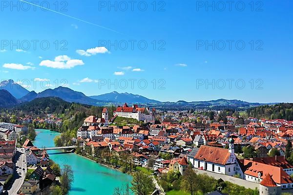 Aerial view of Fuessen with a view of the Lech river, the Benedictine monastery of St. Mang and the high castle. Ostallgaeu Swabia