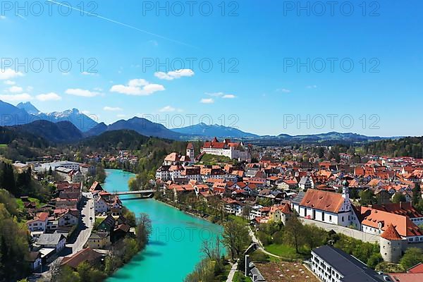 Aerial view of Fuessen with a view of the Lech river, the Benedictine monastery of St. Mang and the high castle. Ostallgaeu Swabia