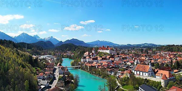 Aerial view of Fuessen with a view of the Lech river, the Benedictine monastery of St. Mang and the high castle. Ostallgaeu Swabia