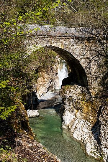 Roman bridge or devil's bridge over the Tauglbach gorge, adventure trail