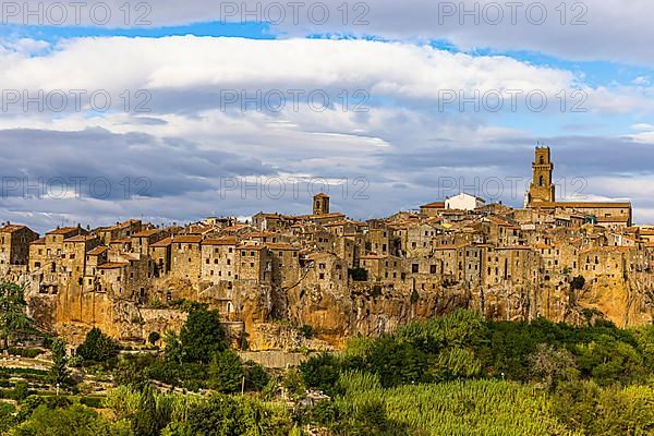 Panoramic view of the medieval town of Pitigliano, dark clouds above