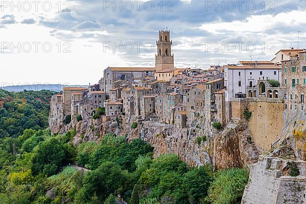 Panoramic view of the medieval town of Pitigliano, dark clouds above