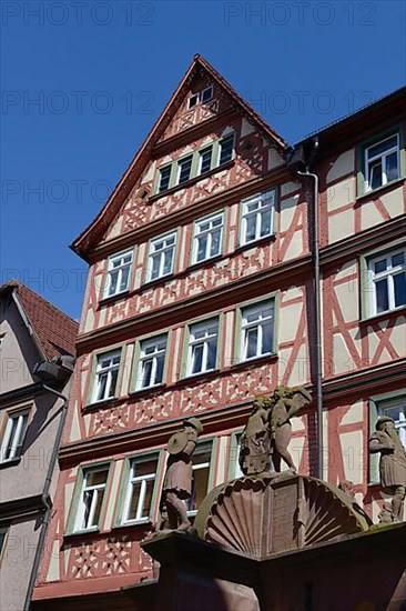 Half-timbered house with fountain in Wertheim am Main, Baden-Wuerttemberg