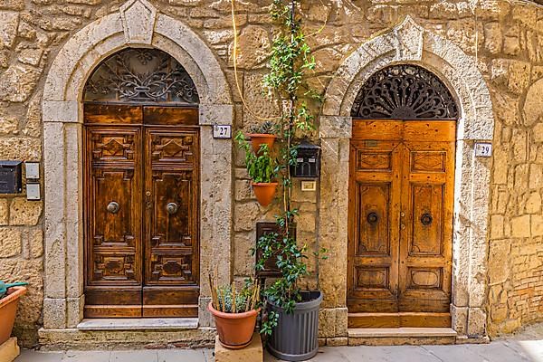 Round arched house entrance doors, edged with white marble