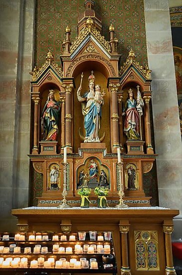 Side altar with sacrificial candles, Catholic Parish Church