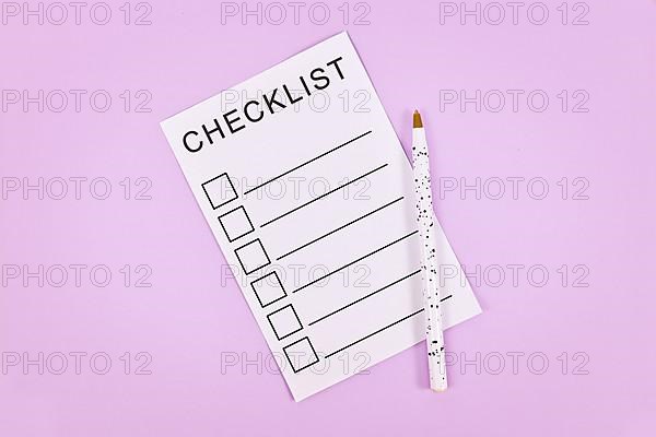 White empty checklist with pencil on violet background,
