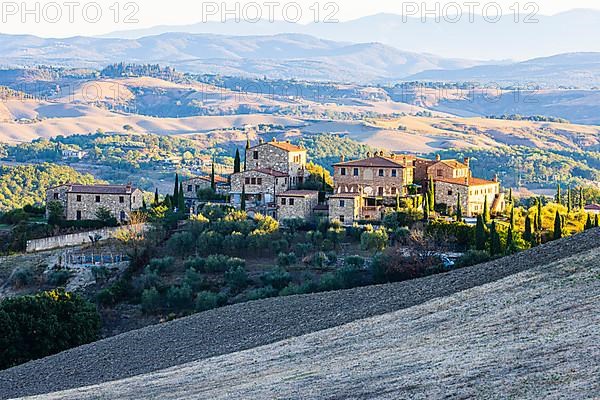 Country houses in the hilly landscape of the Crete Senesi, near Asciano