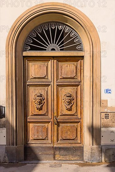 Ornate round arch front door, Florence