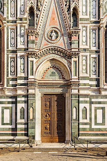 Side entrance and coloured marble facade at Florence Cathedral, Florence