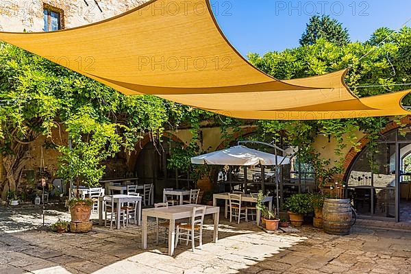 Awning over the cafe in Abbadia Sicille, near Trequanda