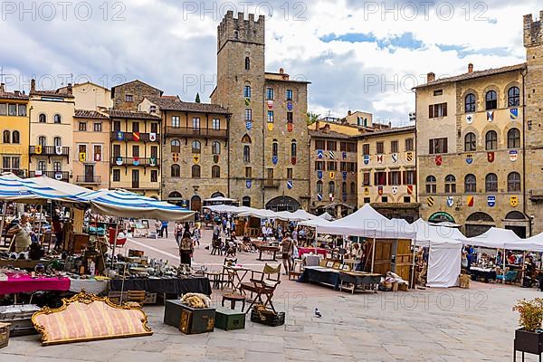 Stalls at the antique market in the old town of Arezzo, Piazza Grande