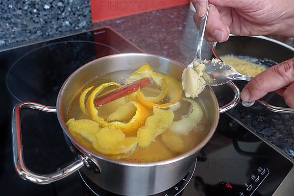 Swabian cuisine, preparation of sweet semolina dumplings in hot water with oranges and lemon zest