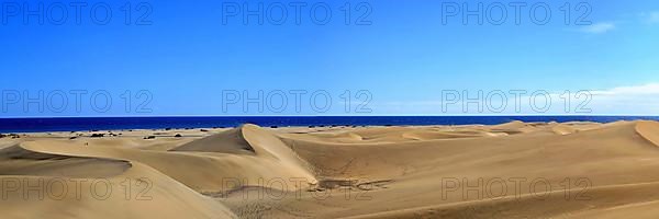 The dunes of Playa Del Ingles with a view of the Atlantic Ocean. San Bartolome de Tirajana, Gran Canaria