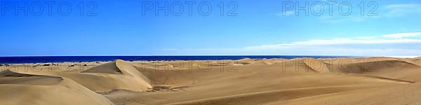 The dunes of Playa Del Ingles with a view of the Atlantic Ocean. San Bartolome de Tirajana, Gran Canaria