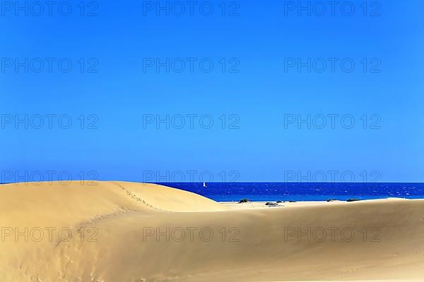 The dunes of Playa Del Ingles with a view of the Atlantic Ocean. San Bartolome de Tirajana, Gran Canaria