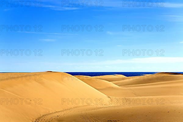 The dunes of Playa Del Ingles with a view of the Atlantic Ocean. San Bartolome de Tirajana, Gran Canaria