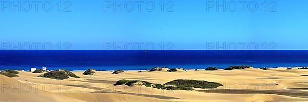 The dunes of Playa Del Ingles with a view of the Atlantic Ocean. San Bartolome de Tirajana, Gran Canaria