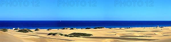 The dunes of Playa Del Ingles with a view of the Atlantic Ocean. San Bartolome de Tirajana, Gran Canaria