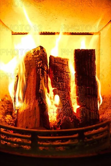 Cosy stove fire with burning logs,