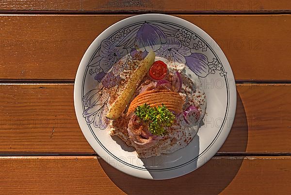 Fillet of maties served in cream sauce in a beer garden, Bavaria