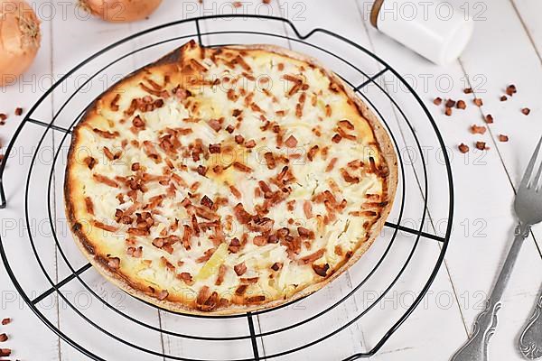 Pizza-like food called 'Tarte Flambee' or 'Flammkuchen' from German-French Alsace border region,