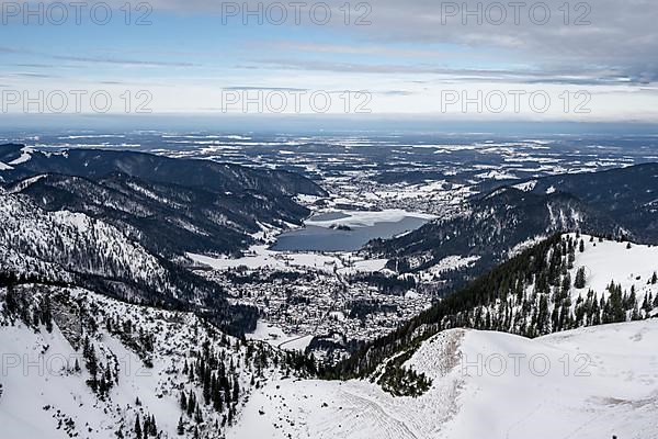 View from the top of the Jagerkamp to Schliersee and village, mountains in winter