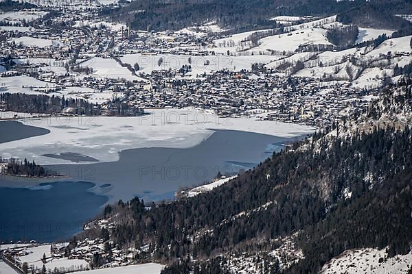 View from the top of the Jagerkamp to Schliersee and village, mountains in winter