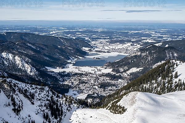 View from the top of the Jagerkamp to Schliersee and village, mountains in winter