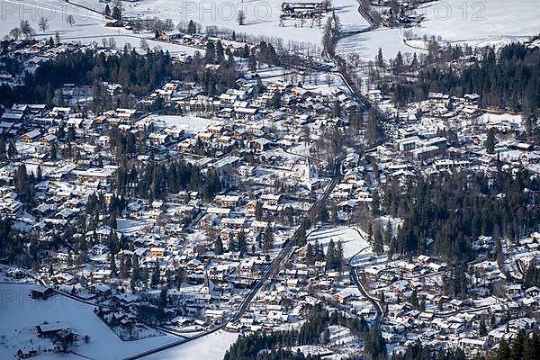 View from the summit of the Jagerkamp to Schliersee, mountains in winter