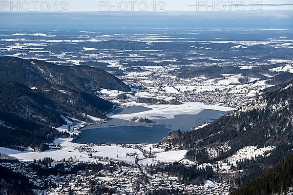 View from the top of the Jagerkamp to Schliersee and village, mountains in winter