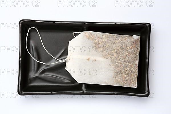 Tea bag in an empty bowl,