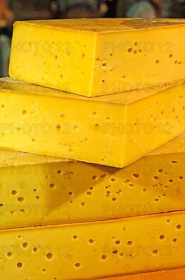 Cheese loaves, cheese in one piece at a market stall in Holland