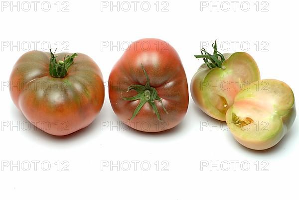 Ripe tomatoes of the Cherokee Tiger variety, red with green stripes