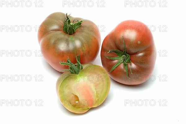 Ripe tomatoes of the Cherokee Tiger variety, red with green stripes