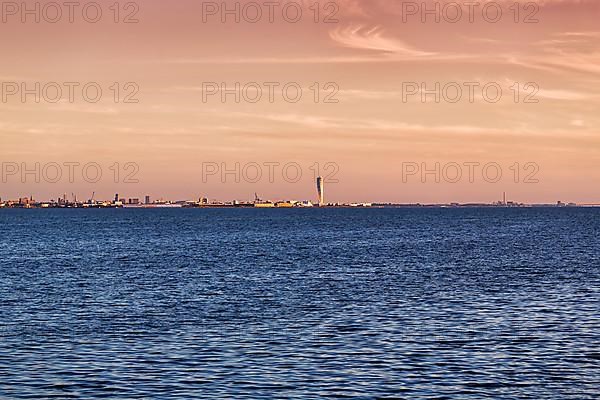 View over the Oeresund to the skyline of Malmoe, Turning Torso skyscraper on the horizon