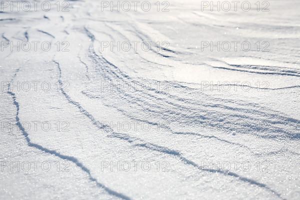 Snow drifts caused by wind from powder snow look like dunes and form bizarre patterns and structures,