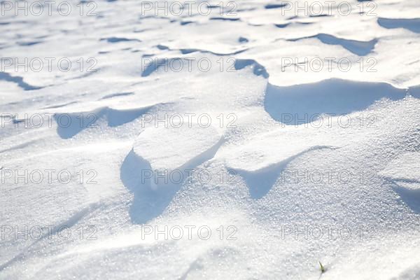 Snow drifts caused by wind from powder snow look like dunes and form bizarre patterns and structures,