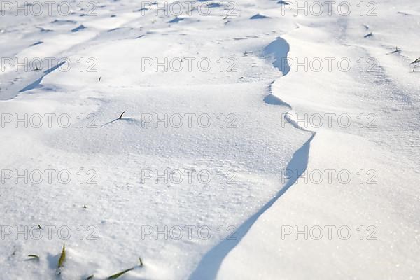 Snow drifts caused by wind from powder snow look like dunes and form bizarre patterns and structures,