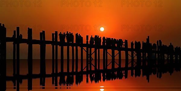 Teak U-leg bridge at sunset. Amarapura, Taungthaman Lake