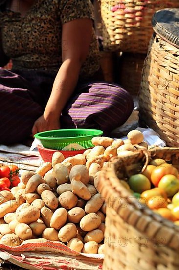 Vegetable vendor at Mani Sithu Market. Nyaung-U, Myanmar