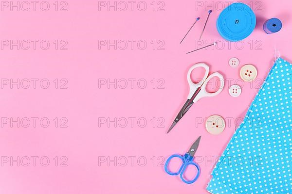 Flat lay with various sewing tools like fabric, scissors