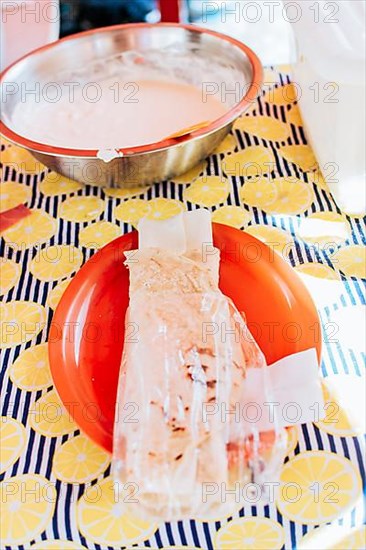 Traditional Nicaraguan Quesillo, food Traditional Large Quesillo served on table. Nicaraguan cheese made and served on the table. Traditional cheese with pickled onion and wrapped tortilla