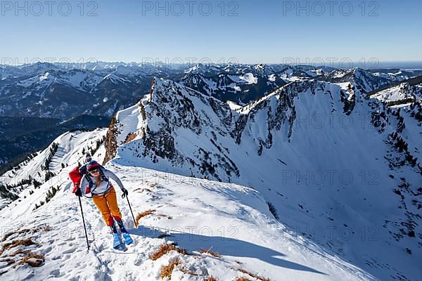 Ski tourers in winter on the snow-covered Rotwand, mountains in winter