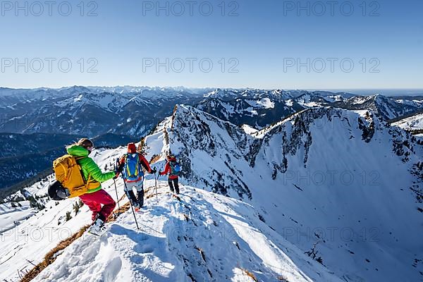 Ski tourers in winter on the snow-covered Rotwand, mountains in winter