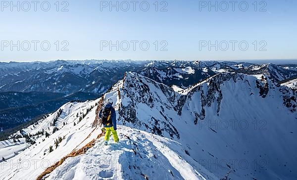 Ski tourers in winter on the snow-covered Rotwand, mountains in winter