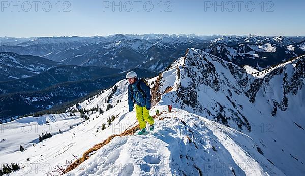 Ski tourers in winter on the snow-covered Rotwand, mountains in winter