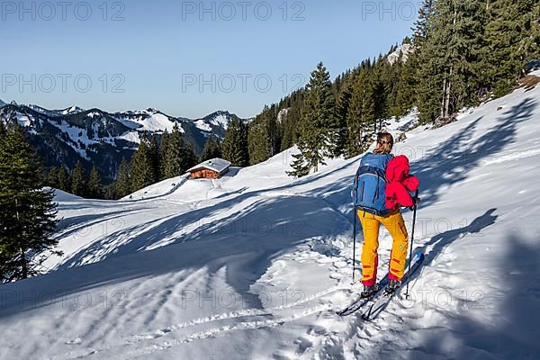 Ski tourers on their way to the Rotwand, mountains in winter