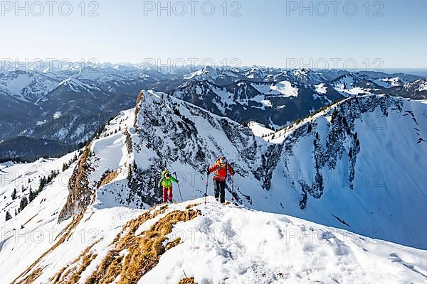 Ski tourers in winter on the snow-covered Rotwand, mountains in winter