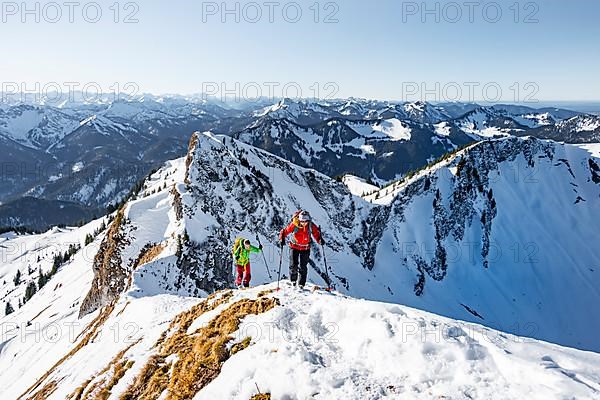 Ski tourers in winter on the snow-covered Rotwand, mountains in winter