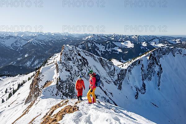 Ski tourers in winter on the snow-covered Rotwand, mountains in winter